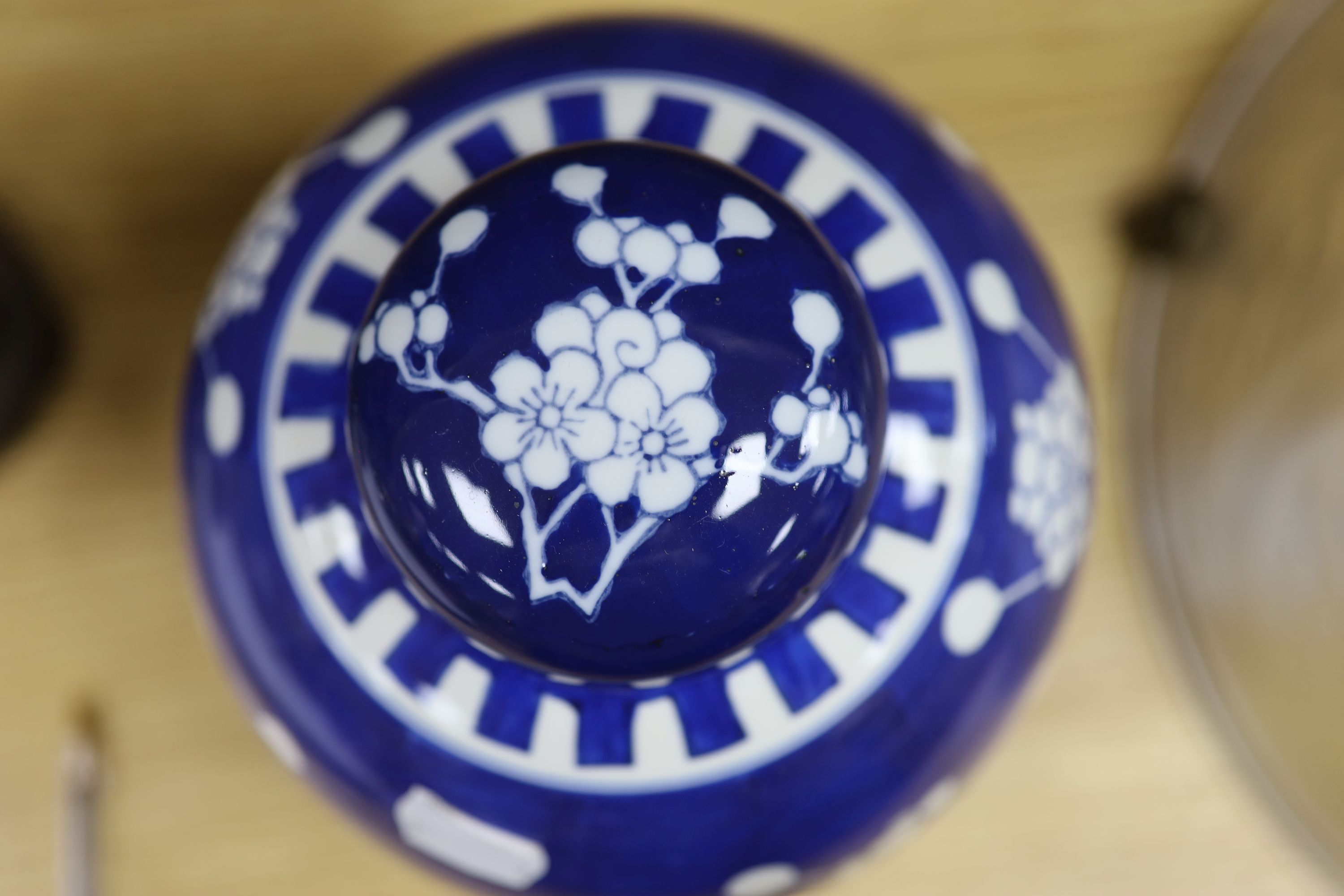 A Chinese blue and white cylindrical vase, another vase and cover and a blue and white jar and cover, together with a cloisonne vase and a bronze censer, tallest 32cm